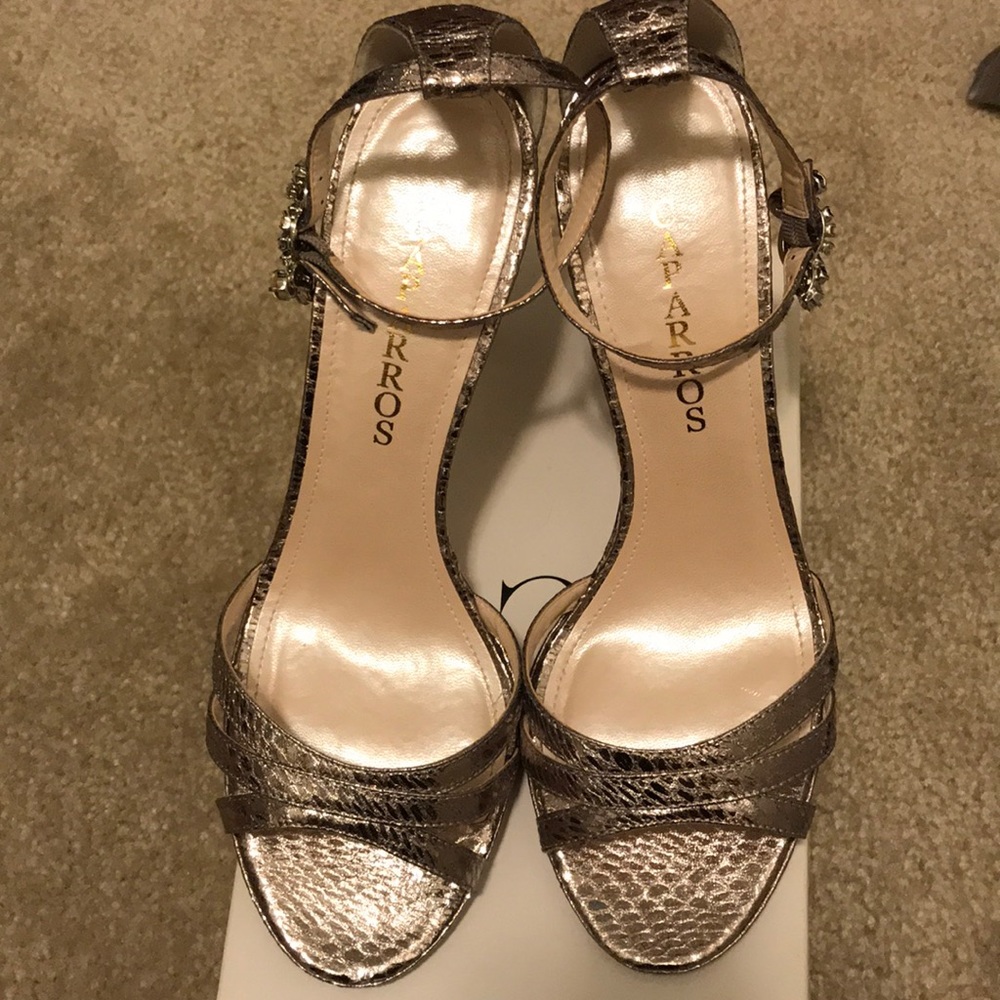 Beautiful caparros silver jeweled 4” heels.